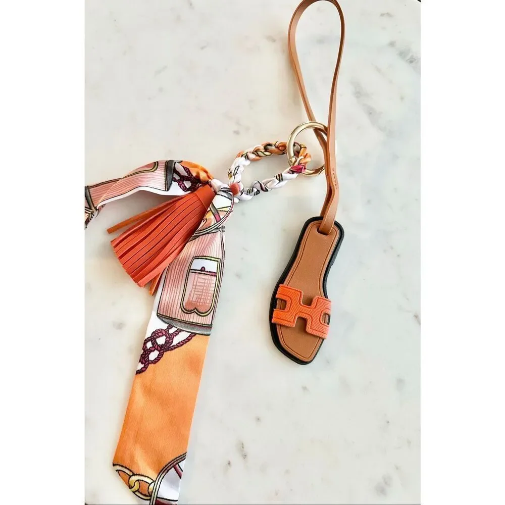 Bright orange purse charm flip-flop and pattern scarf